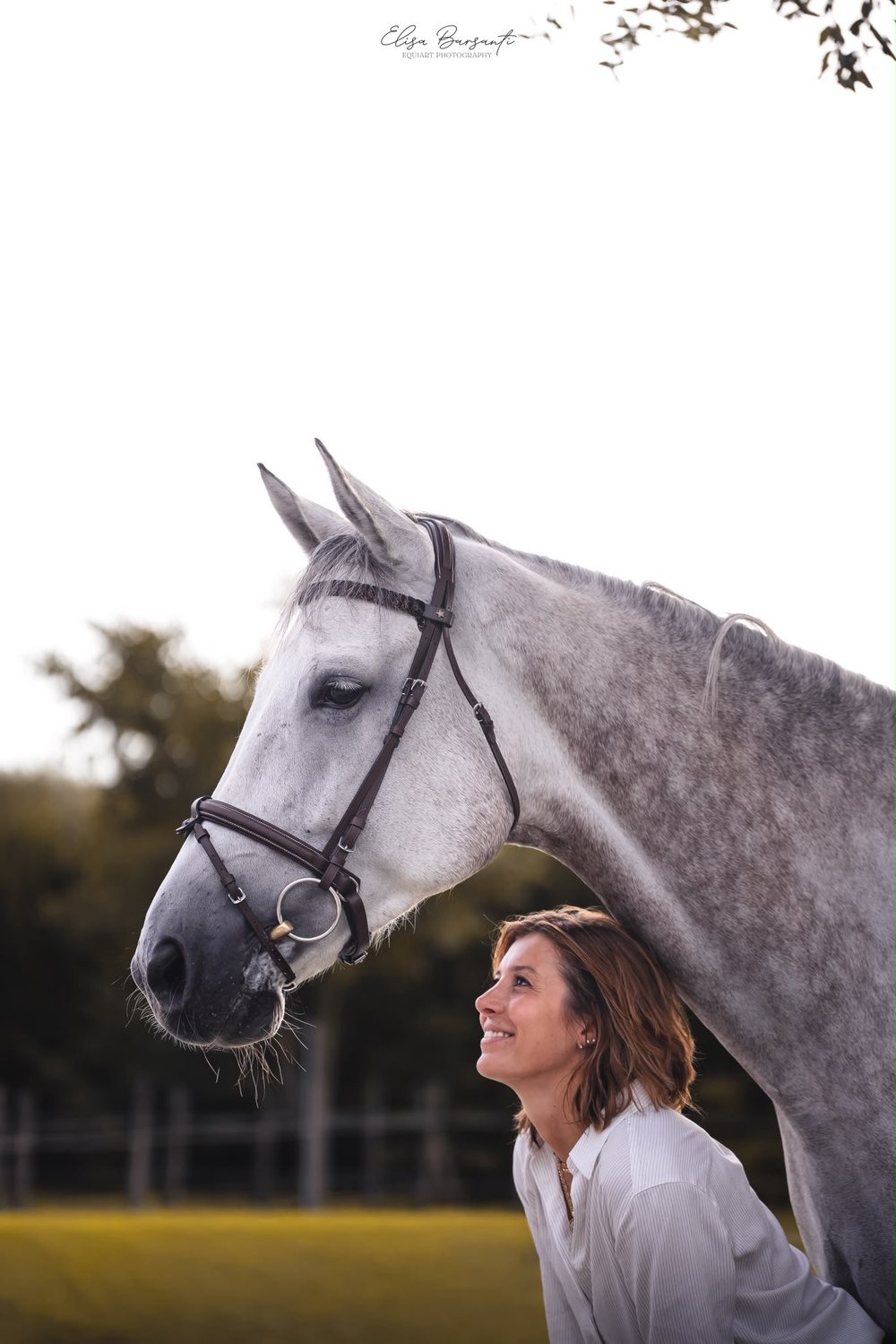 Alice Orlandi with a grey horse